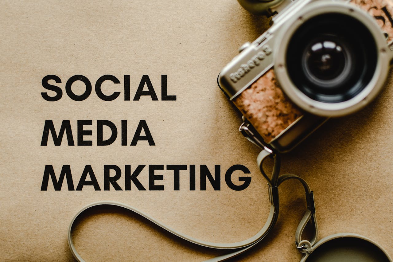 about-01 A vintage camera on brown paper with SOCIAL MEDIA MARKETING text, perfect for marketing visuals.